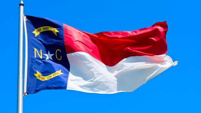 Close-up of a North Carolina flag that is flying in the air stock photo