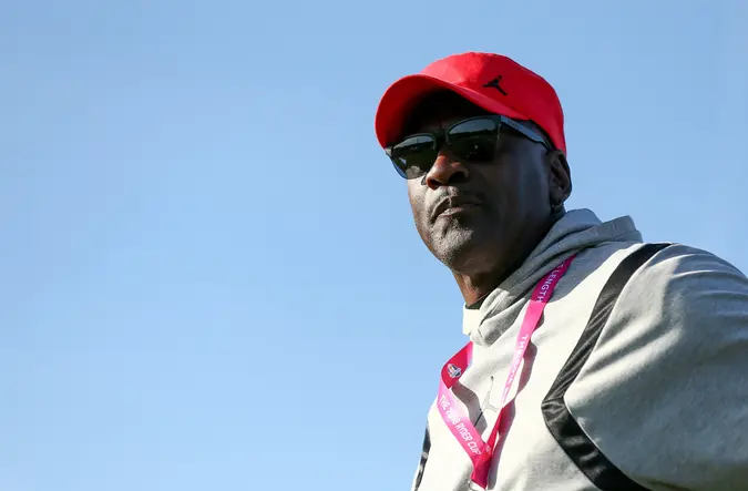 Mandatory Credit: Photo by James Marsh/BPI/Shutterstock (9904495p)Michael Jordan watches the group of Tiger Woods.