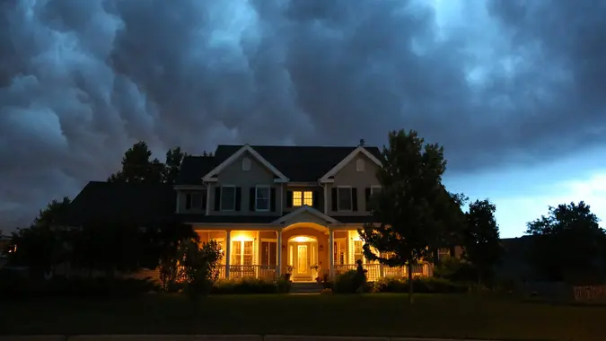 House in bad summer thunderstorm stock photo