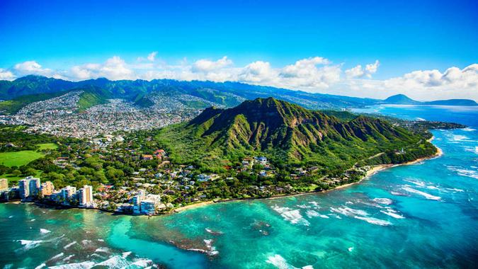 The dormant volcano known as Diamond Head located adjacent to downtown Honlulu, Hawaii, as shot from an altitude of about 1500 feet over the Pacific Ocean.