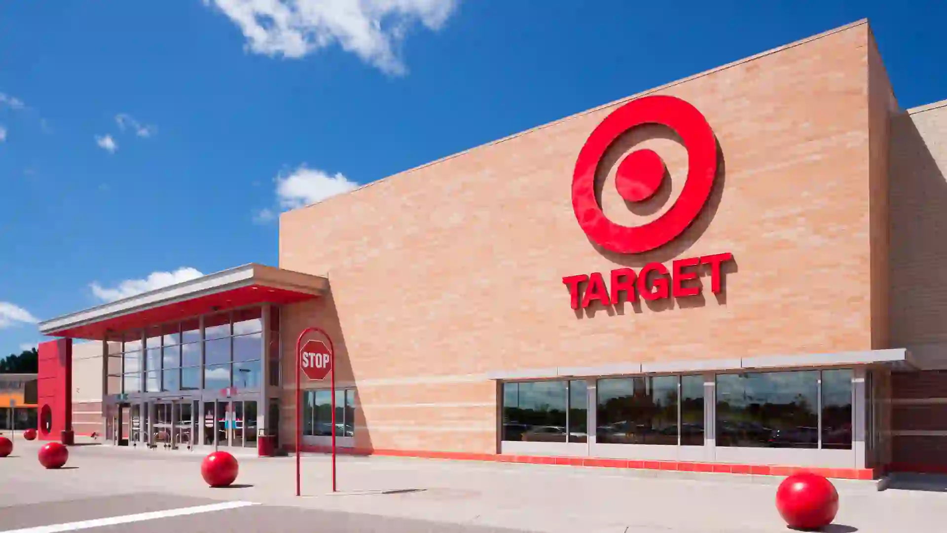 The outside of a Target shopping location on a sunny day with blue skies.