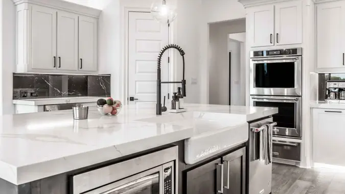 A view of a kitchen with beautiful, modern interior.