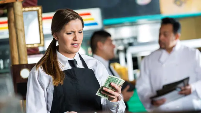 Waitress in Tex-Mex restaurant disappointed in small tip from customer.