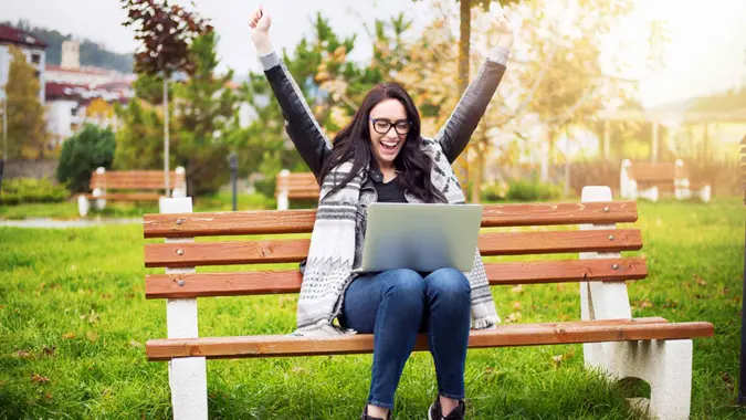 Euphoric winner watching a laptop.