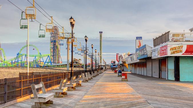 Seaside Heights, New Jersey, USA - April 4, 2022: Daytime view of the Casino Pier and shops on the boardwalk along the beach.