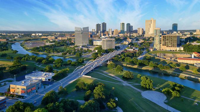 Aerial view of downtown Ft Worth Texas during the day with Trinity River in the foreground.