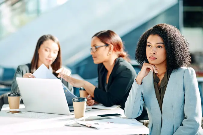 Cropped shot of young businesswomen having a meeting in the convention centre.