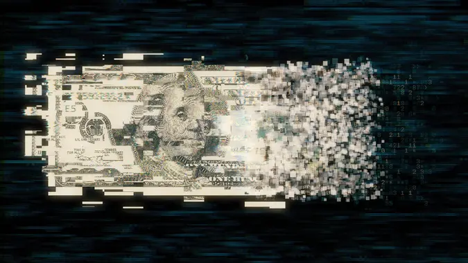 Pixelated us paper currency on dark background stock photo