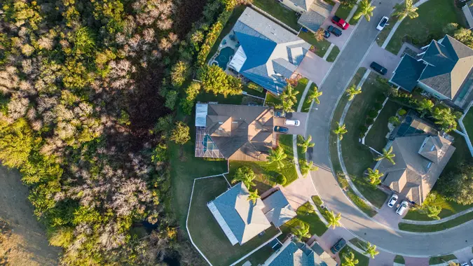 Drone shot of houses at a neighborhood with palm trees near Tampa, Florida, USA