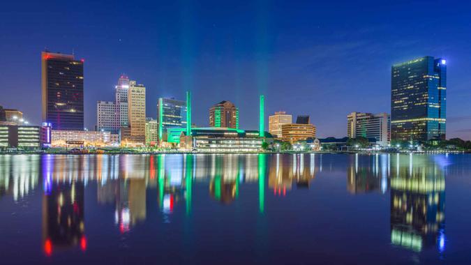 Toledo, Ohio, USA downtown skyline on the Maumee River at twilight.