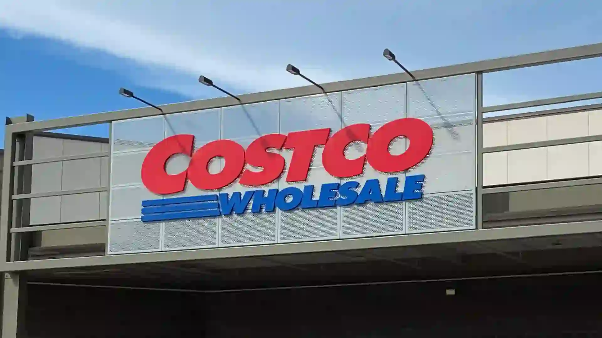A closeup image of a Costco Wholesale logo storefront sign