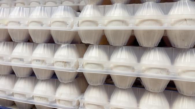 Eggs in plastic packaging on the shelves in the supermarket. stock photo