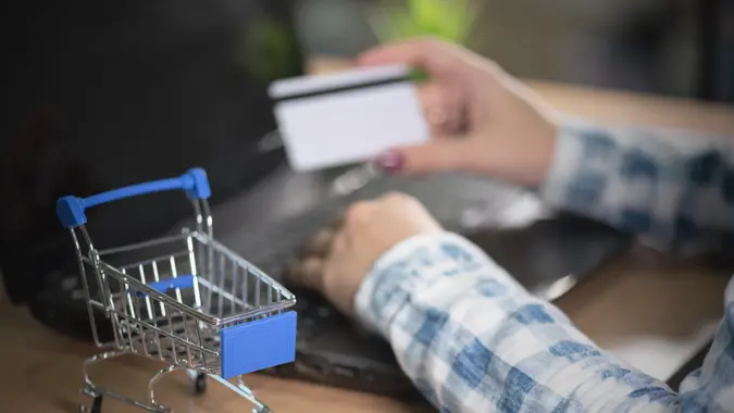 A woman buys goods in an online store.