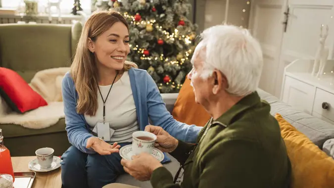 Senior people celebrating Christmas at nursing home.