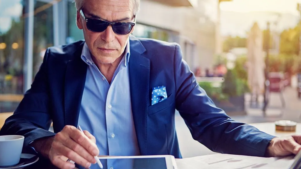 Businessman is working with digital tablet in the cafe stock photo