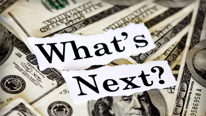 Hundred dollar bills with the words "What's Next?".