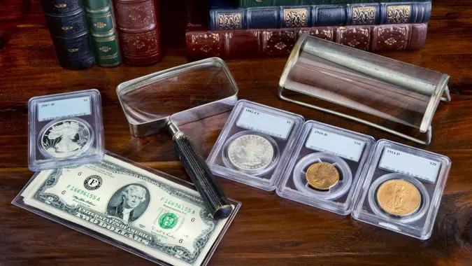 Coin collection with on table with literature.