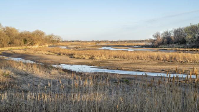 springtime sunrise over wide and shallow Platte River near Kearney, Nebraska.