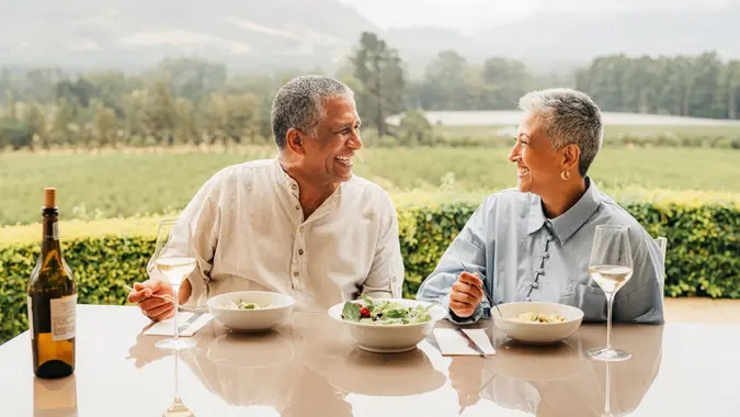 A rich couple spends time together and eats lunch.