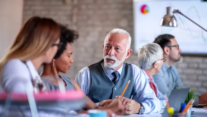 Group of  business people working together in creative office.