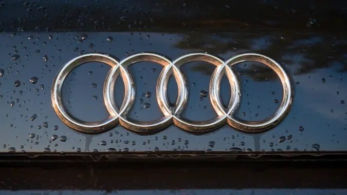 "Padua, Italy - July 6, 2011: Audi logo on a wet car hood.