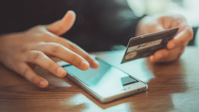 Mobile Pnone Shopping Online With A Debit Card.