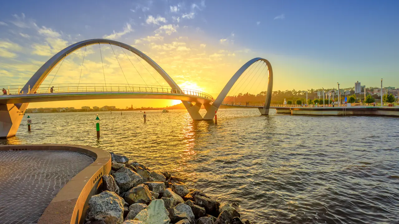 Scenic and iconic Elizabeth Quay Bridge at sunset light on Swan River at entrance of Elizabeth Quay marina.