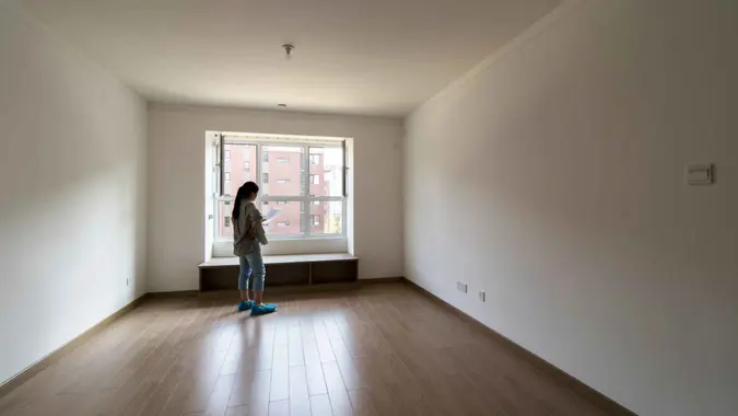 girl in new house, planning house decoration.
