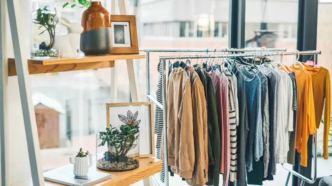Shot of clothing hanging on a rack in an empty boutique.
