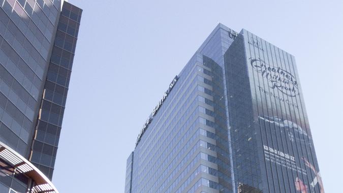 Phoenix, USA - February 8, 2016: Shiny bank tower of Western Alliance Bank covered with advertisements at Washington Street in downtown of Phoenix, AZ.