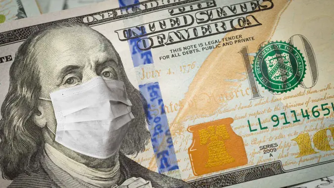 One Hundred Dollar Bill With Medical Face Mask on George Washington.