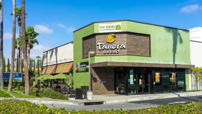 Anaheim, CA, USA – November 1, 2022: A Now Hiring banner sign at a Panera Bread restaurant located on Harbor Blvd in Anaheim, California.