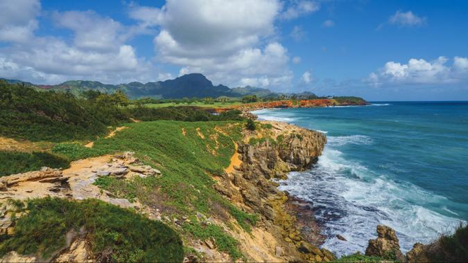 Mahaulepu trail Koloa Poipu Waiopili Heiau rough coastline on Kauai Hawaii USA.