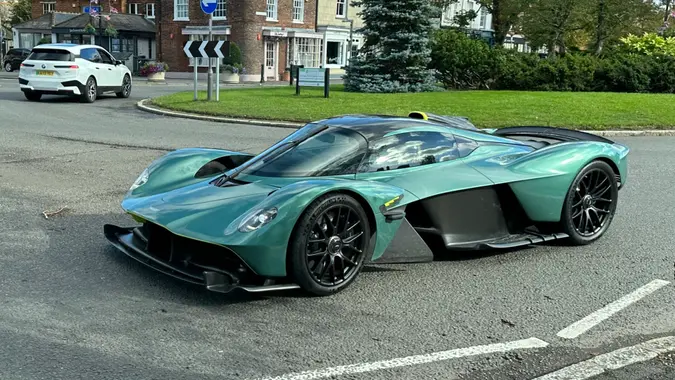 Beaconsfield, Buckinghamshire - October 14, 2023: The spectacular Aston Martin Valkyrie, as spotted driving around the roundabout in Beaconsfield Old Town.