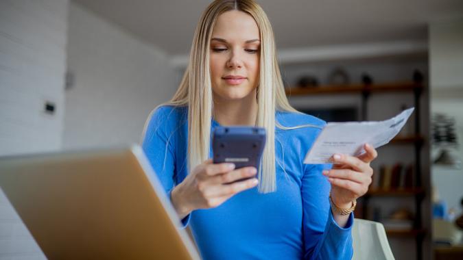 Young woman going through paperwork stock photo