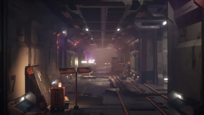 Dimly lit bunker passageway with equipment strewn about. stock photo