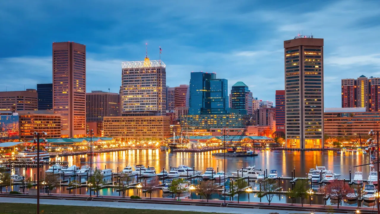 View on Baltimore skyline and Inner Harbor from Federal Hill at dusk, Maryland.