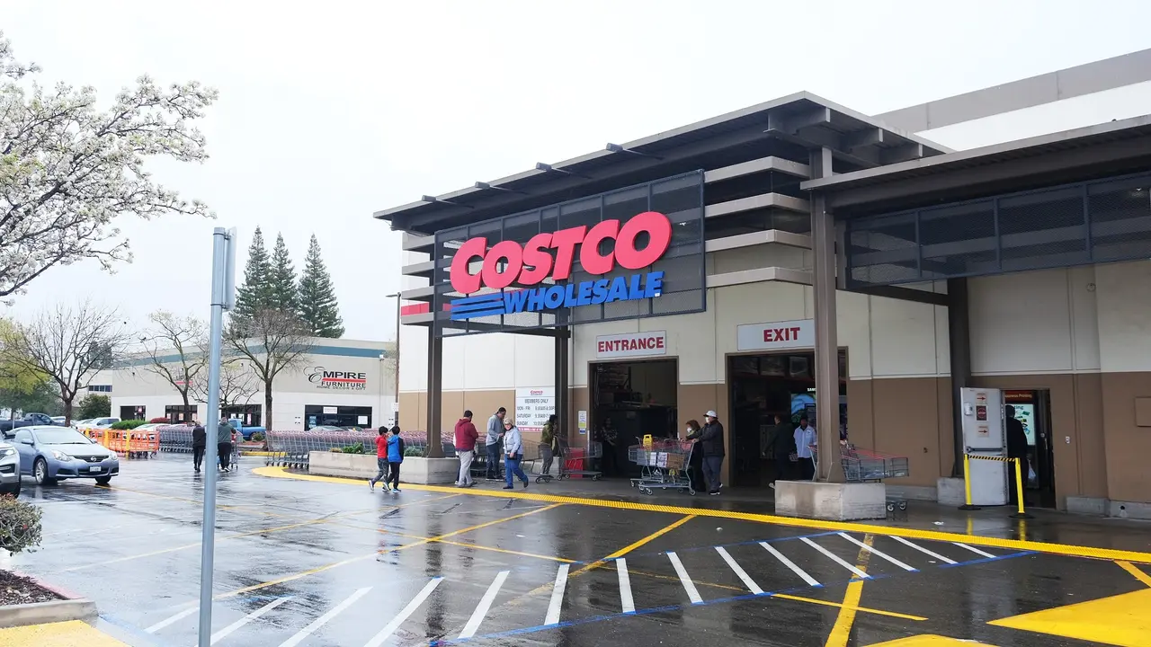 The exterior of a Costco store on rainy day.