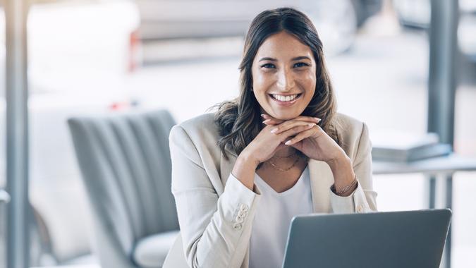 Woman, portrait and laptop in office planning, legal consulting or policy review feedback in corporate law firm.