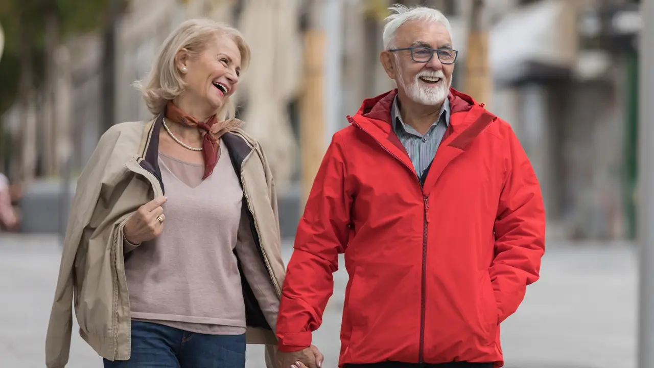 An Older Woman and her Husband are Spending a Wonderful Day Together in City Walk.