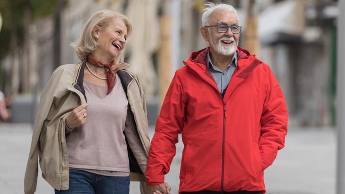 An Older Woman and her Husband are Spending a Wonderful Day Together in City Walk. stock photo