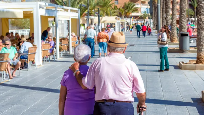 A senior couple walking on the streets of Torrevieja stock photo