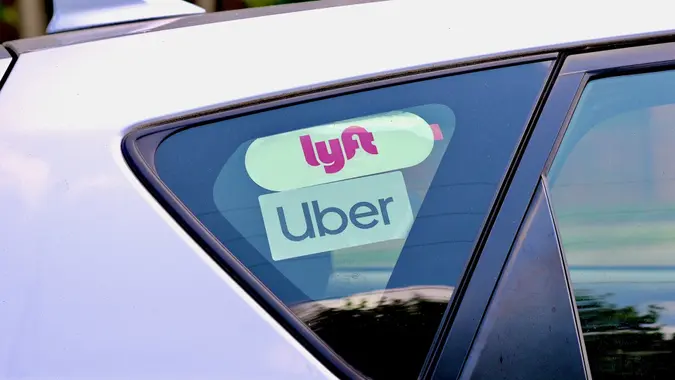 Lyft and Uber Stickers Inside Car, George Mason University, Fairfax, Virginia (USA) stock photo