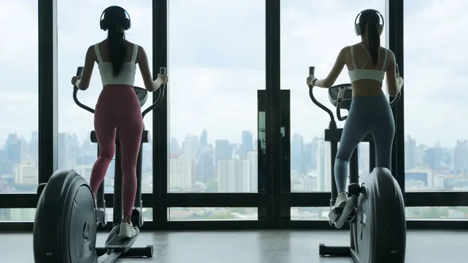 Pretty women are exercising at sport club. stock photo