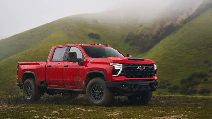 The Silverado HD ZR2 Bison stationary on a muddy trail.