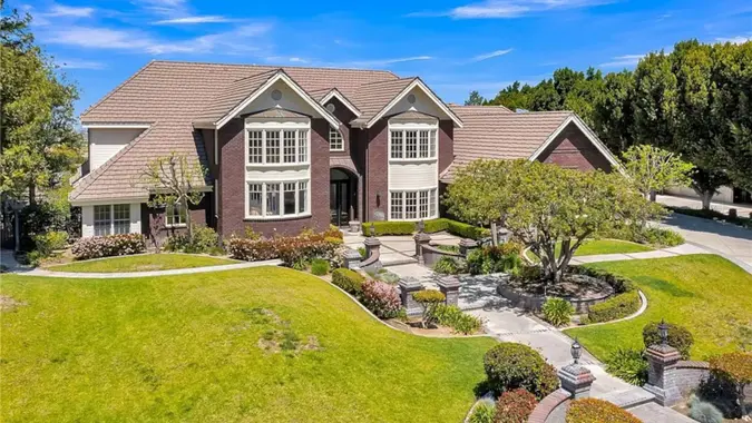 A large house in Riverside, California, featuring a large front yard.