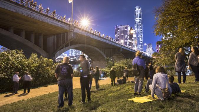 Bat watching under the Congress Avenue Bridge in Austin Texas USA stock photo