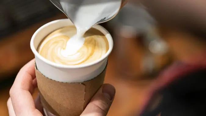 Barista make coffee cup latte art stock photo.