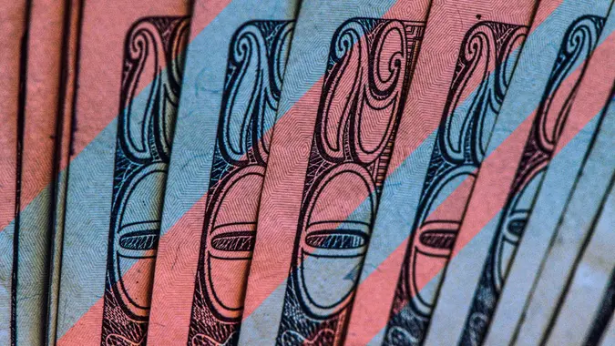 $20 dollar bills with red and blue tint