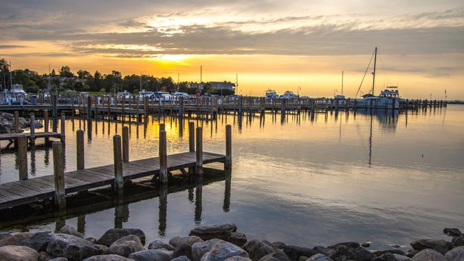 Summer sunset of over a Lake Michigan harbor and marina in the coastal town of Petoskey Michigan.